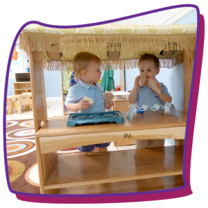 2-year-old kids playing under canopy