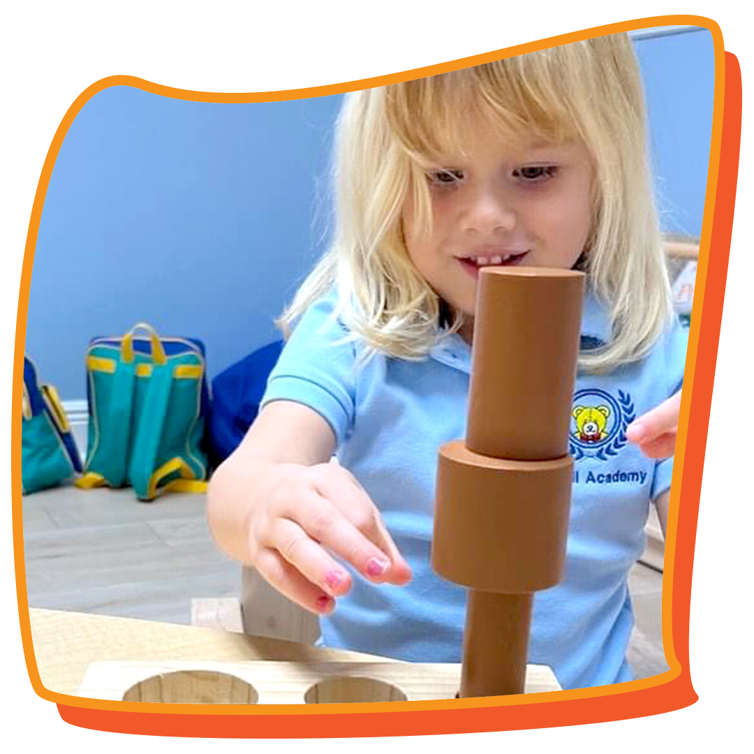 3-year-old girl playing with blocks